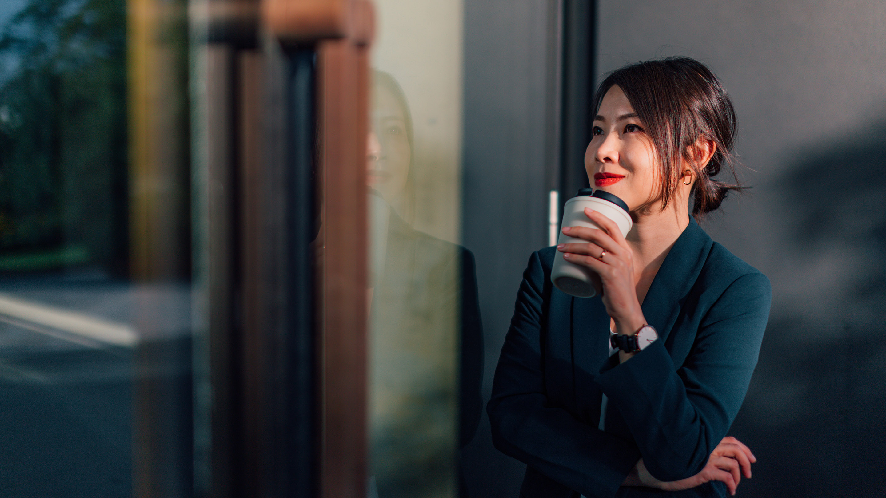  Happy woman enjoying a coffee.