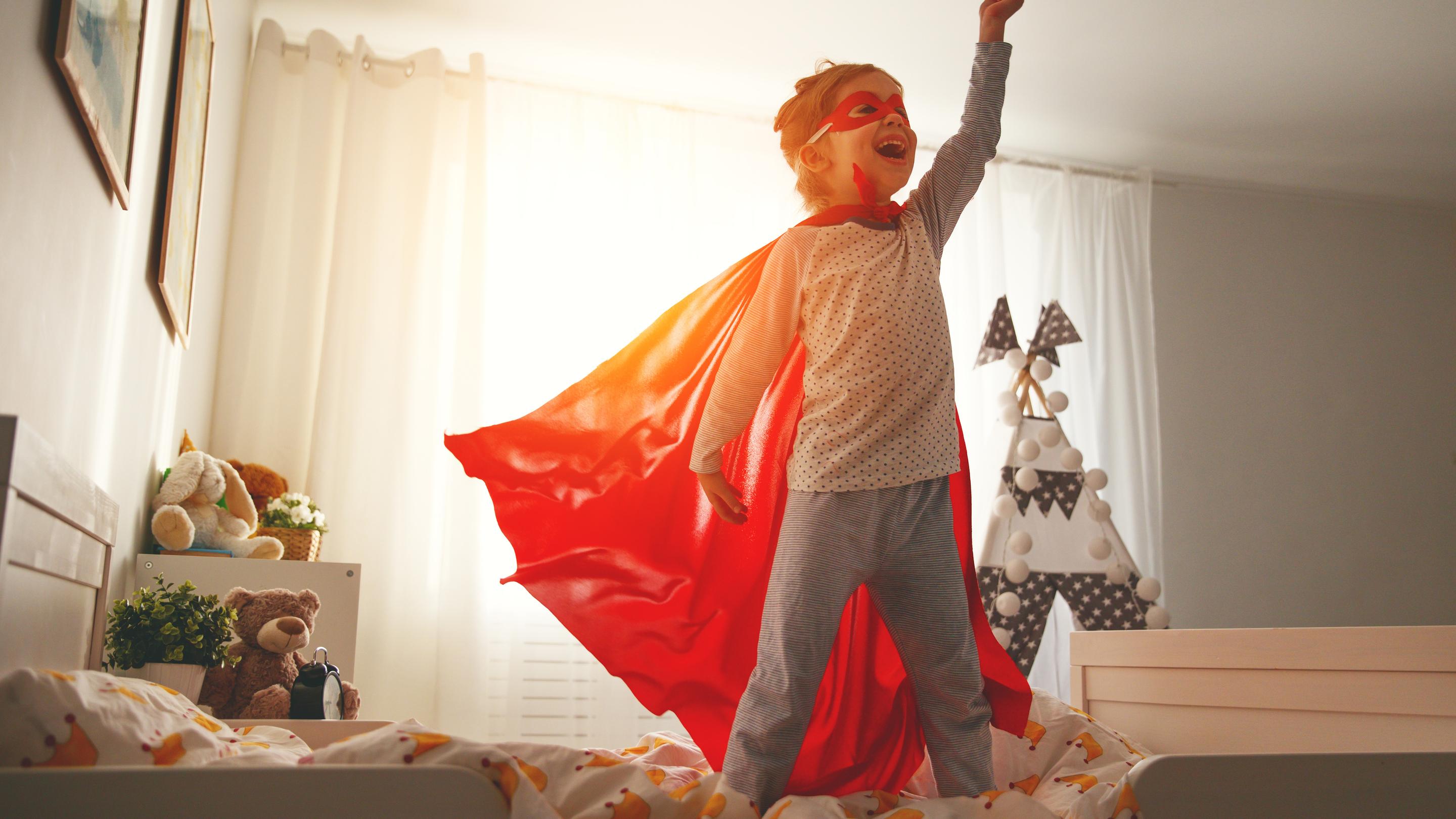  A young child dressed as a superhero.